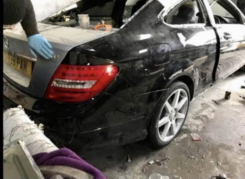 Mercedes C-Class masked and prepared for bodywork repair